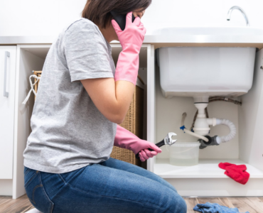 woman calling a plumber